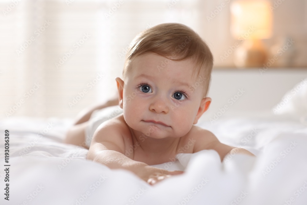 Cute baby lying on bed at home Cute baby lying on bed at home