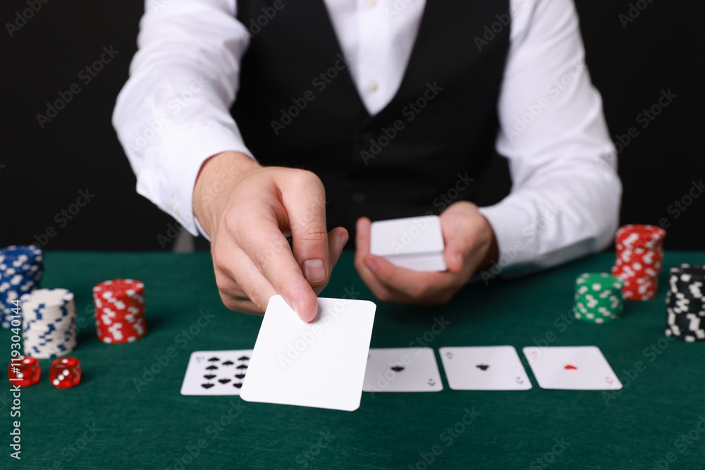 Professional croupier with playing cards at gambling table, closeup Professional croupier with playing cards at gambling table, closeup
