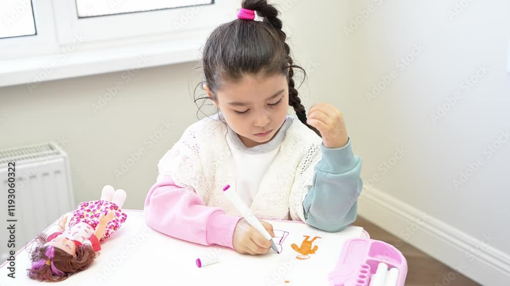 Girl is drawing in a notebook. Little girl drawing with colorful pencils. Children drawing at notebook on the table at home. Kids education. . High quality 4k footage Girl is drawing in a notebook. Little girl drawing with colorful pencils. Children drawing at notebook on the table at home. Kids education. . High quality 4k footage