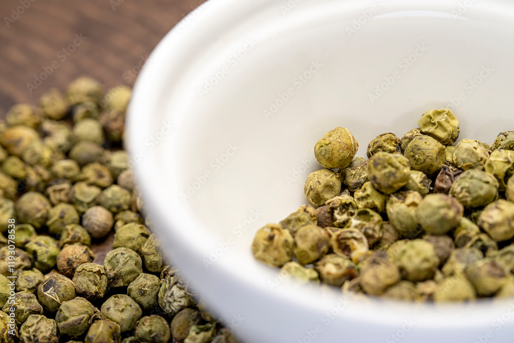 Dry green pepper spice close up. Green peppercorns macro view. Dry green pepper spice close up. Green peppercorns macro view.