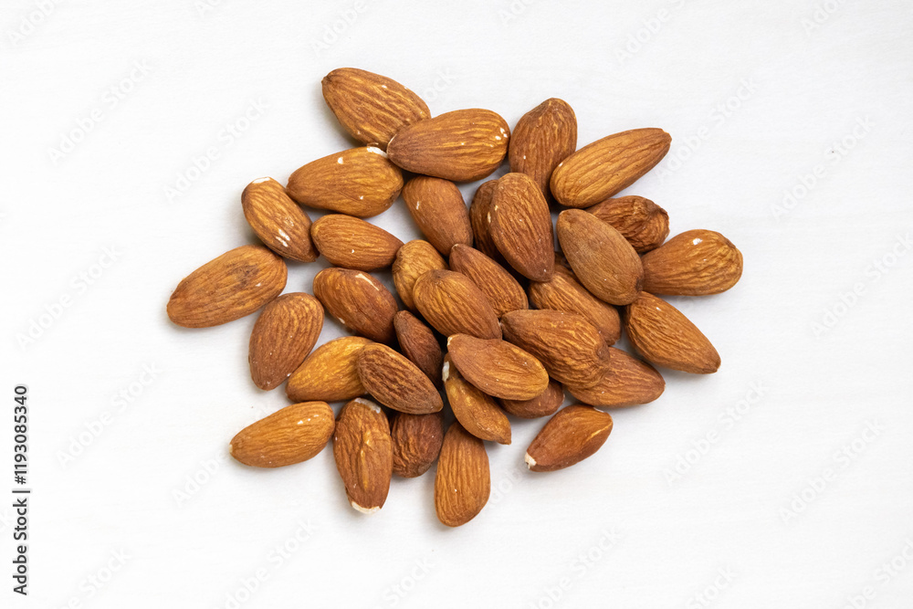 Fresh almonds isolated on a white background. A healthy food for life and a natural diet concept. Top view. Fresh almonds isolated on a white background. A healthy food for life and a natural diet concept. Top view.