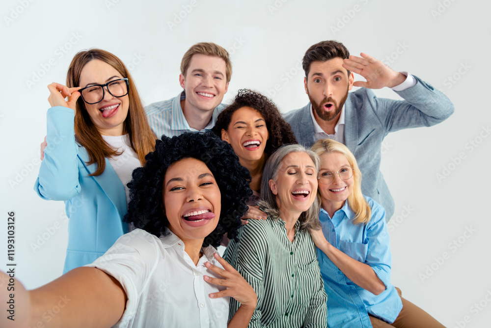 Diverse group of professionals enjoying a friendly moment together in a team environment Diverse group of professionals enjoying a friendly moment together in a team environment