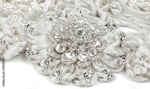 Closeup white silk floral bridal sash with crystals on white background for wedding fashion