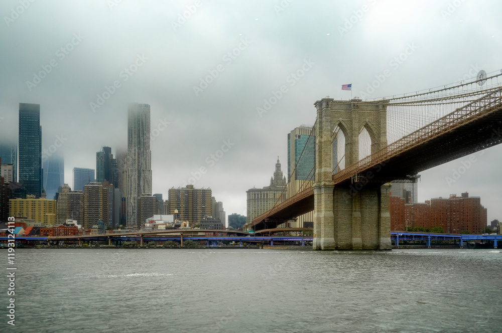 View of Brooklyn Bridge and skyscrappers in New York City - USA