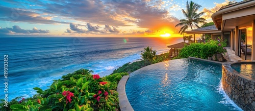 Sunset over a luxurious tropical vacation destinations resort with infinity pools and beachfront cabanas Stock Photo with side copy space photo