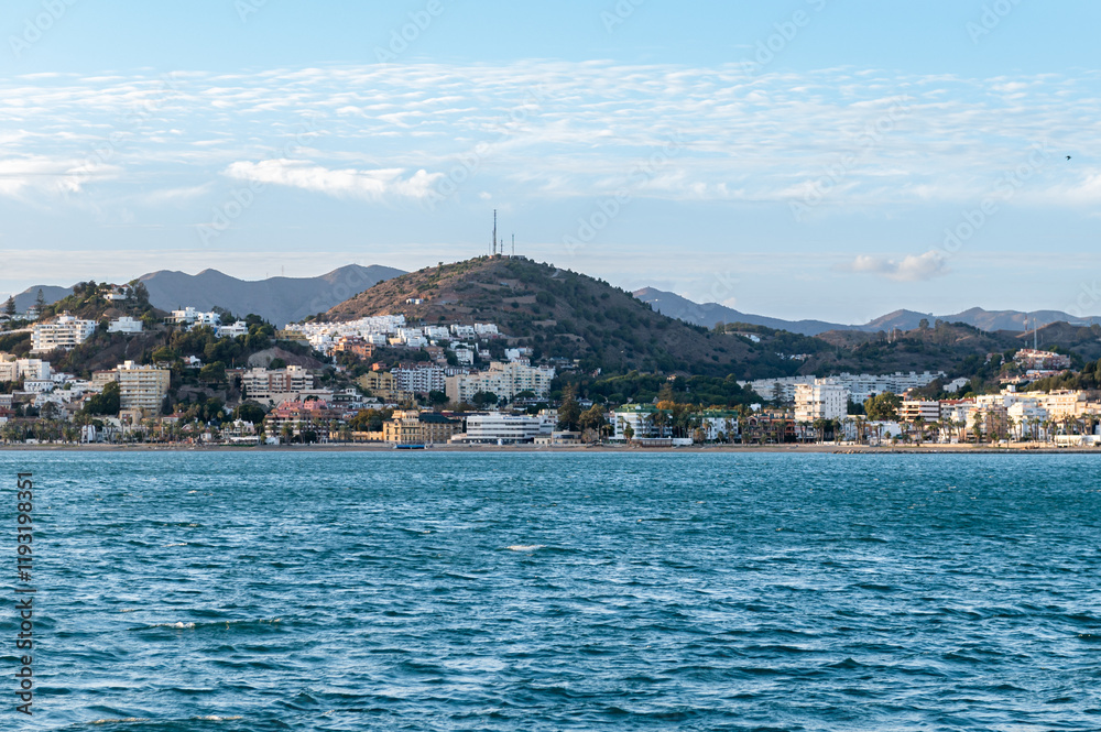 Fototapeta premium Coast Line near Malaga, Costa del Sol, Spain shoot from the boat during sunset. Beautiful Alboran Sea