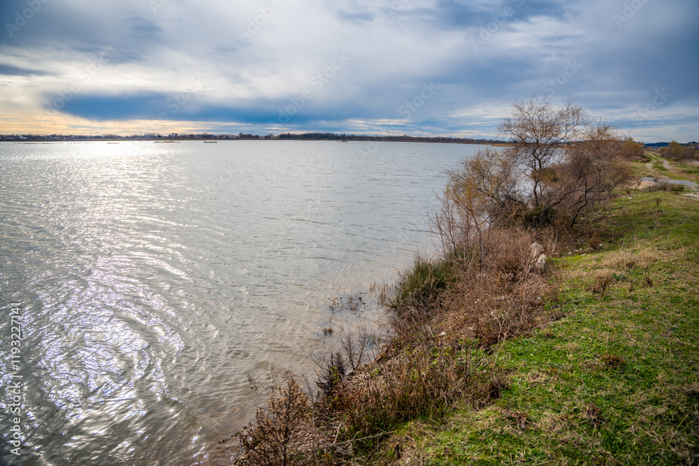 Landscape view of Salina nature park with flamingos near Ulcinj town in winter time in Montenegro Landscape view of Salina nature park with flamingos near Ulcinj town in winter time in Montenegro