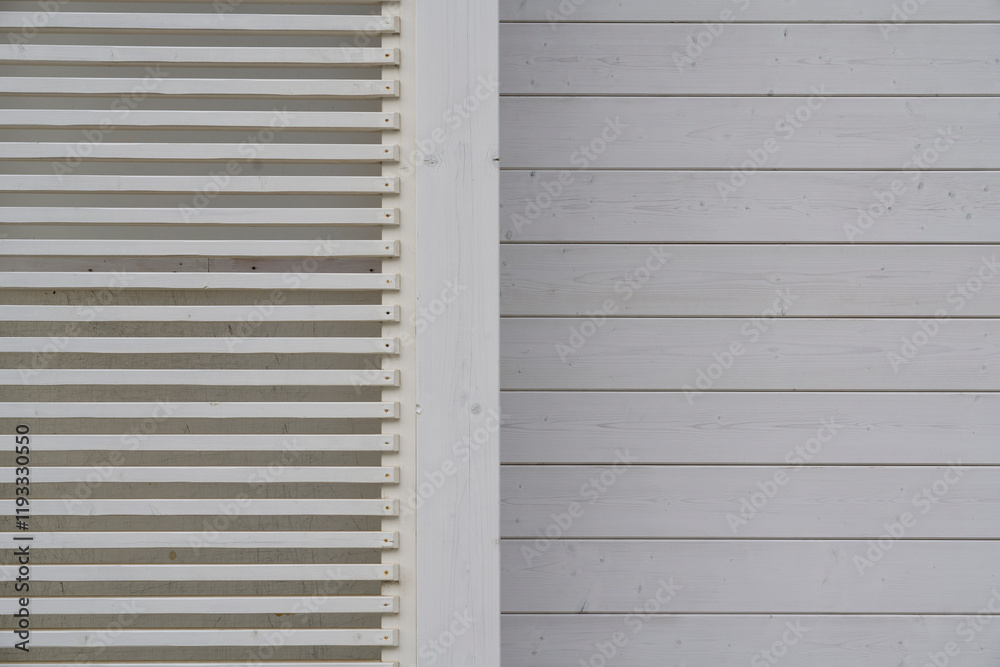 Close-up of a wooden slatted and paneled wall with a minimalisti Close-up of a wooden slatted and paneled wall with a minimalisti