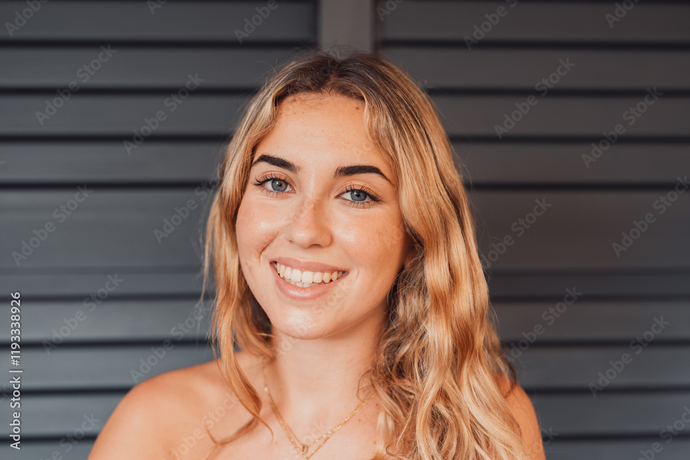 One young happy millennial woman smiling and looking at the camera. Beauty natural woman laughing having fun and enjoying at home. One young happy millennial woman smiling and looking at the camera. Beauty natural woman laughing having fun and enjoying at home.