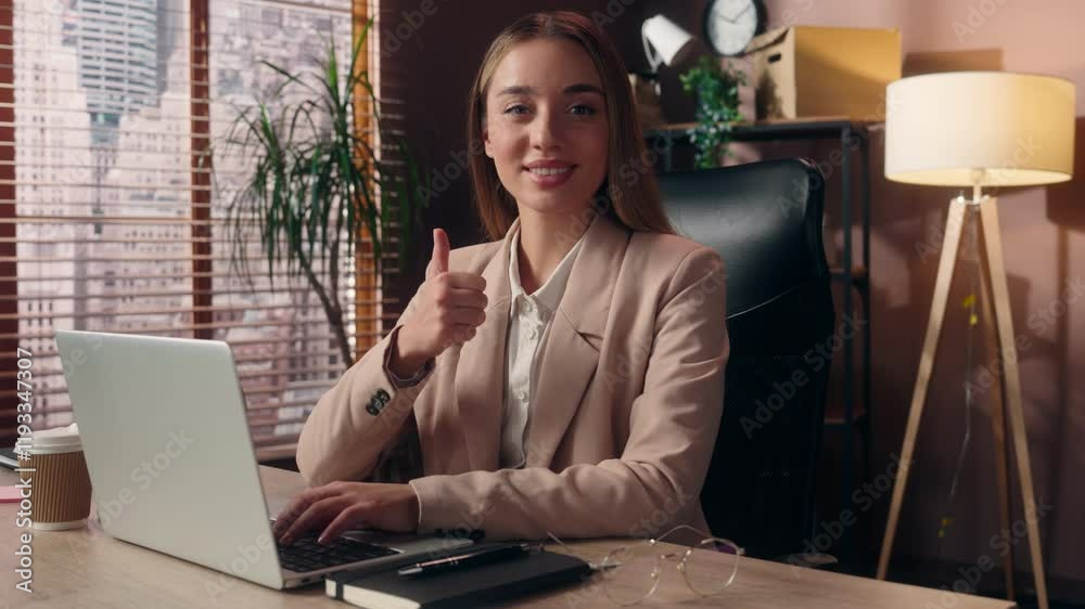 Happy smiling Caucasian specialist business woman satisfied female lady businesswoman joyful office worker work laptop networking looking at camera show thumb up gesture approve like recommend indoor