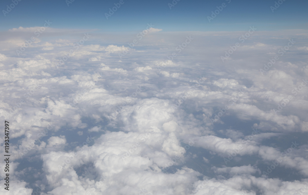 sea of white clouds seen from above during an intercontinental flight on a passenger plane sea of white clouds seen from above during an intercontinental flight on a passenger plane