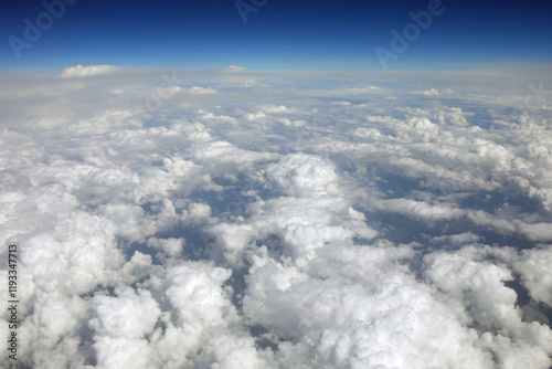 view of white clouds from the window of an airplane in flight during the intercontinental journey
