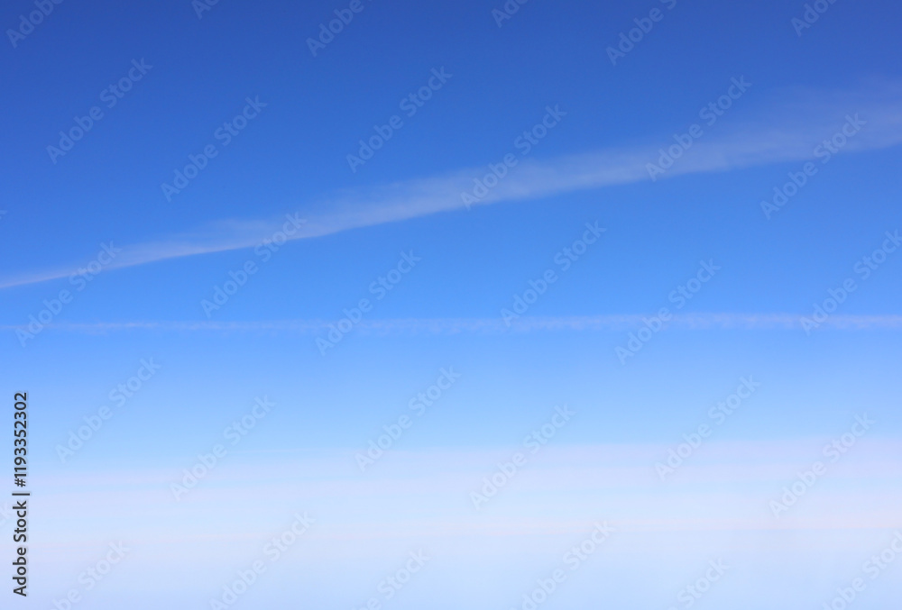 airplane contrails crisscross a vivid blue sky with scattered clouds, captured from an aerial perspective, highlighting the beauty of flight airplane contrails crisscross a vivid blue sky with scattered clouds, captured from an aerial perspective, highlighting the beauty of flight