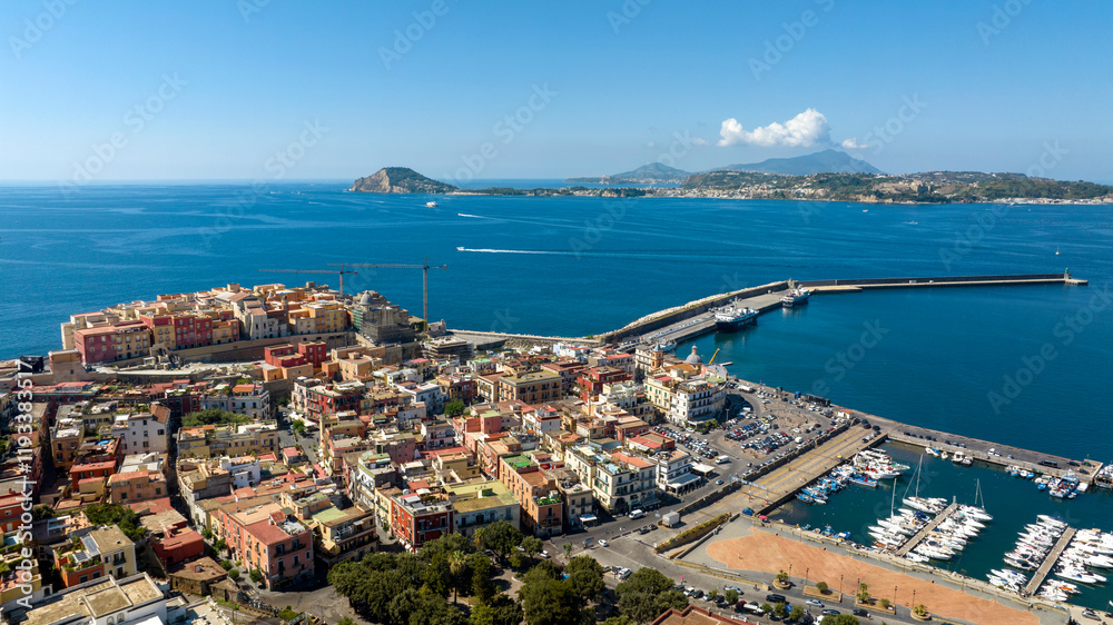 Aerial panoramic view of the city of Pozzuoli, near Naples, Italy. In background are the Tyrrhenian Sea, the promontory of Capo Miseno and Ischia island. Aerial panoramic view of the city of Pozzuoli, near Naples, Italy. In background are the Tyrrhenian Sea, the promontory of Capo Miseno and Ischia island.