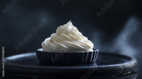 Creamy White Frosting in Dark Dish