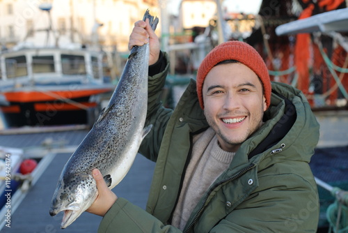 Fisherman showing a beautiful salmon  photo