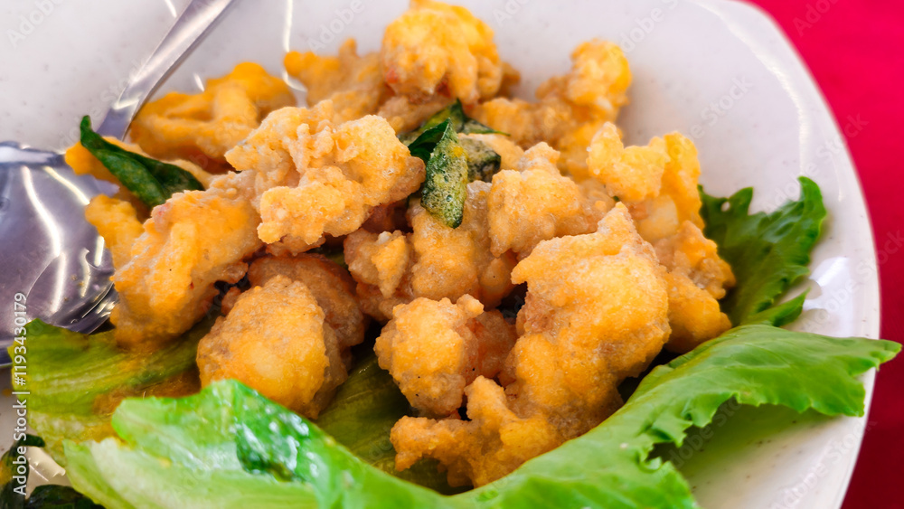 Asian Seafood Dishes: Deep Fried Squid or Calamari on the plate. Asian Seafood Dishes: Deep Fried Squid or Calamari on the plate.