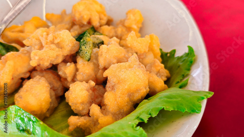 Asian Seafood Dishes: Deep Fried Squid or Calamari on the plate. 