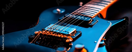 A close-up view of a blue electric guitar showcasing its intricate details and vibrant colors against a dark background.