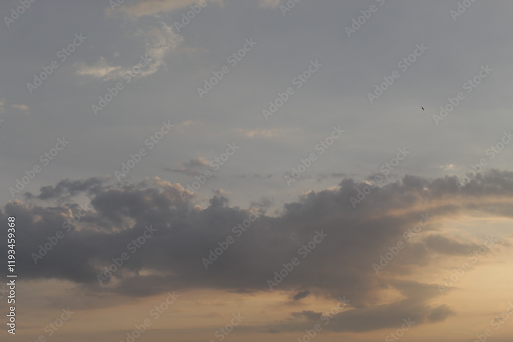 Beautiful sky with natural gradations. Thick clouds in the dusk sky on a winter night. Image of a cloudy sky in the afternoon. View of the night sky with golden light from the evening sun Beautiful sky with natural gradations. Thick clouds in the dusk sky on a winter night. Image of a cloudy sky in the afternoon. View of the night sky with golden light from the evening sun