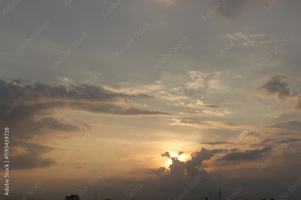Beautiful sky with natural gradations. Thick clouds in the dusk sky on a winter night. Image of a cloudy sky in the afternoon. View of the night sky with golden light from the evening sun Beautiful sky with natural gradations. Thick clouds in the dusk sky on a winter night. Image of a cloudy sky in the afternoon. View of the night sky with golden light from the evening sun