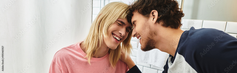 Two joyful men share a tender moment, smiling at each other in a warm and inviting space. Two joyful men share a tender moment, smiling at each other in a warm and inviting space.