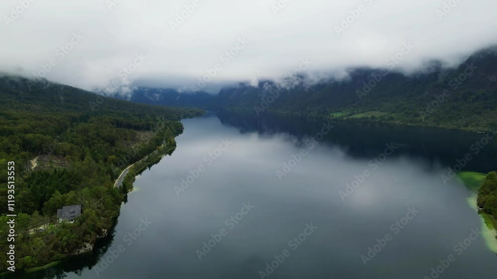 lake bohinj with mountains background (aerial view of famous alpine travel destination in slovenia) boat kayaking scenic european tourism getaway (julian alps, europe) aerial view scenic landscape lake bohinj with mountains background (aerial view of famous alpine travel destination in slovenia) boat kayaking scenic european tourism getaway (julian alps, europe) aerial view scenic landscape