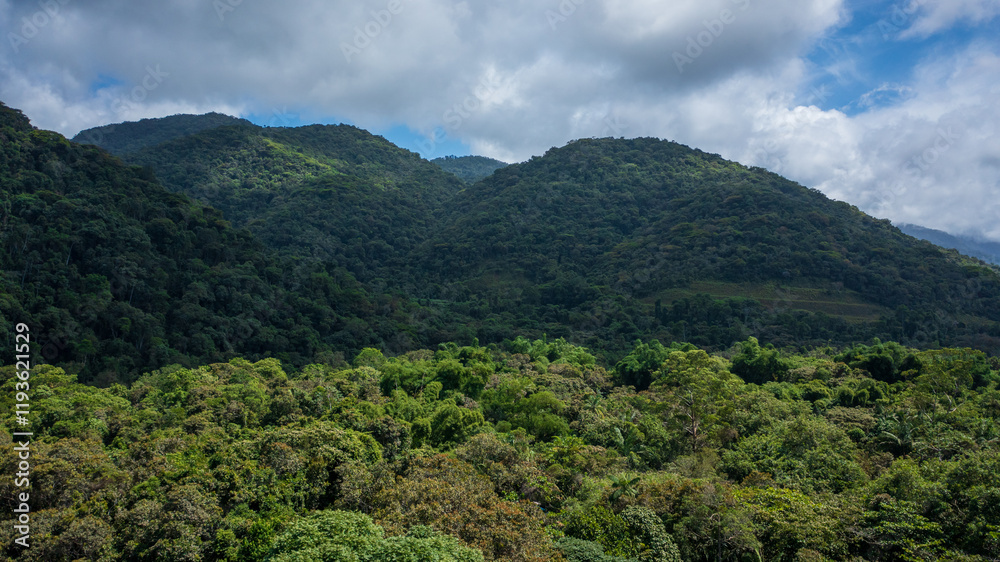 Beautiful aerial view of the preserved mountains of the Serra do Mar State Park, Ubatuba / SP, in the Atlantic Forest biome, near Praia da Fazenda, a sustainable tourist destination. Beautiful aerial view of the preserved mountains of the Serra do Mar State Park, Ubatuba / SP, in the Atlantic Forest biome, near Praia da Fazenda, a sustainable tourist destination.