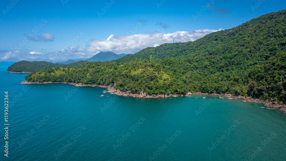 Beautiful aerial view of a preserved area, Fazenda Beach, within the Serra do Mar State Park, a destination for sustainable and ecological tourism in Atlantic Rainforest, between Montains and Sea. Beautiful aerial view of a preserved area, Fazenda Beach, within the Serra do Mar State Park, a destination for sustainable and ecological tourism in Atlantic Rainforest, between Montains and Sea.