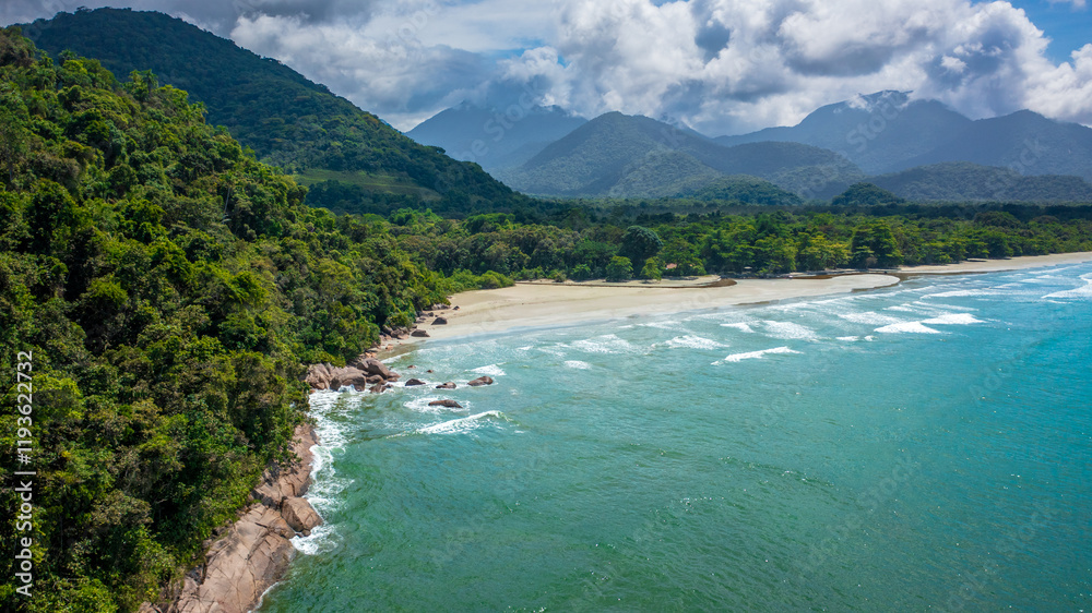 Beautiful aerial view of a preserved area, Fazenda Beach, within the Serra do Mar State Park, a destination for sustainable and ecological tourism in Atlantic Rainforest, between Montains and Sea. Beautiful aerial view of a preserved area, Fazenda Beach, within the Serra do Mar State Park, a destination for sustainable and ecological tourism in Atlantic Rainforest, between Montains and Sea.