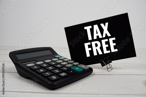 Tax Free text message with calculate on wooden background photo