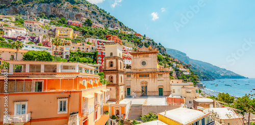 Positano coastline in south of Italy, vertiginous cliffs adorned with colorful villages, turquoise waters. Small town Positano on Amalfi Coast near Neapol, Italy photo