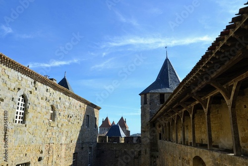 Historic castle courtyard under a clear blue sky photo