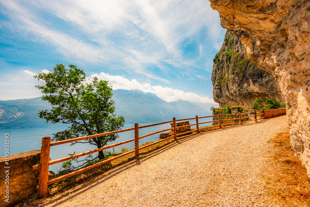 Obraz premium Tagliata del Ponale, Lake Garda, Italy. Lago di garda. Hiking Tagliata del Ponale along the shore of the lake with a view of the surrounding countryside