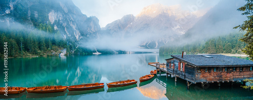 Bild auf Leinwand Lago di Braies or Pragser Wildsee lake with boats and fishing dock
