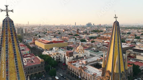 Guadalajara cathedral towers rising above downtown skyline at sunset. Jalisco, Mexico