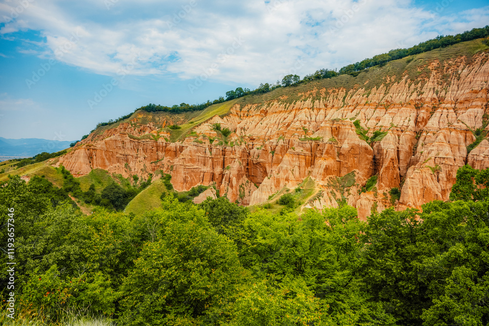 Fototapeta premium Red rocky slopes Rapa Rosie is a protected geological and floristic reservation area near Sebes alba in Romania