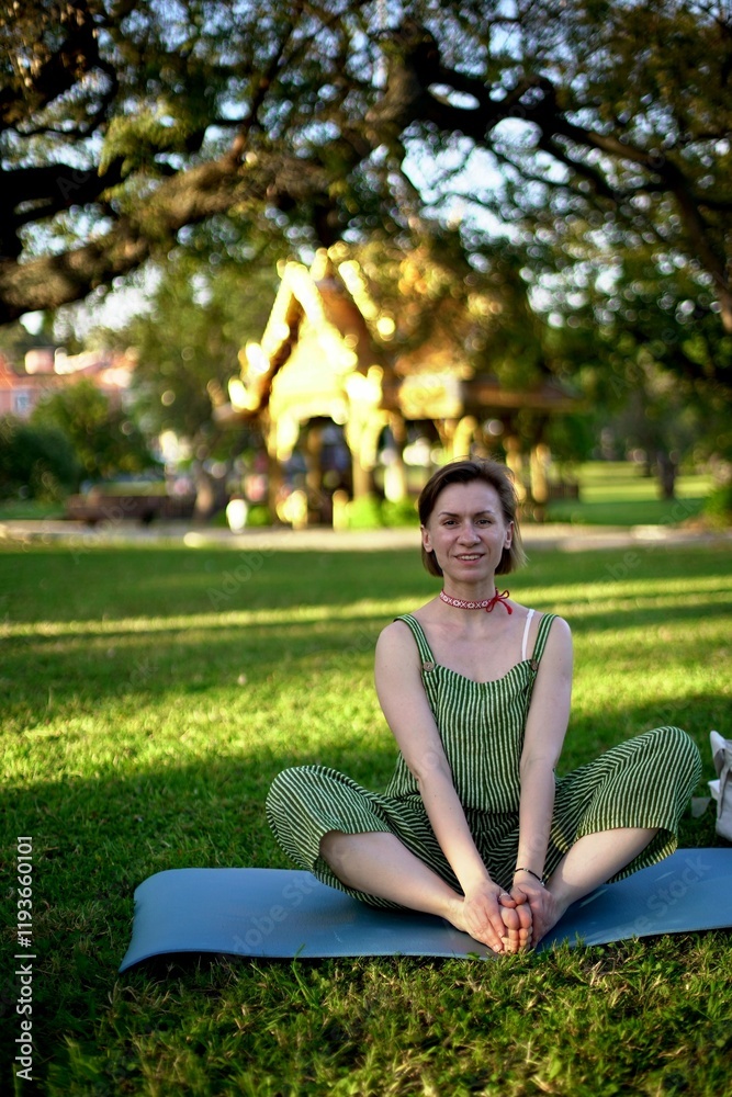 woman doing exercises in the park. Meditation. Slow Motion. Training. woman doing exercises in the park. Meditation. Slow Motion. Training.