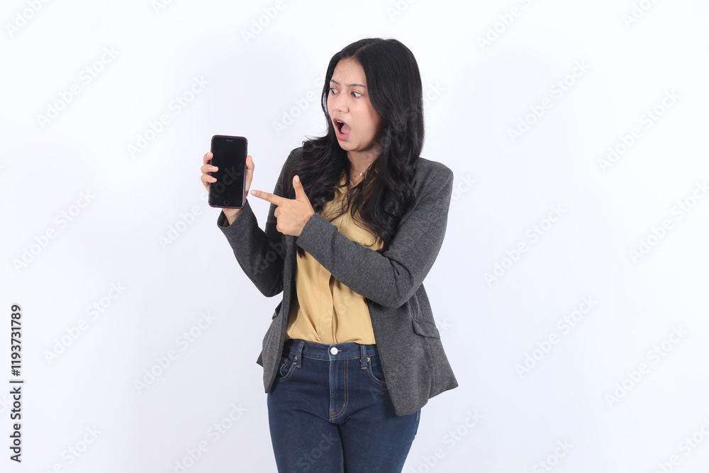 Woman is pointing at mobile phone with blank screen. Business asian woman Woman is pointing at mobile phone with blank screen. Business asian woman