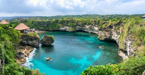 The Banyumala waterfall, named for its twin falls on a mountain slope, tumbles into a turquoise blue pond, creating a picturesque scene in a tropical rainforest photo