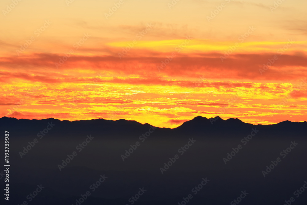 sunset over the mountains with clouds sunset over the mountains with clouds