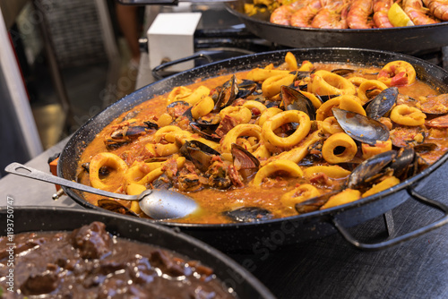 Saintes-Maries-de-la-Mer, Bouches-du-Rhone, Provence-Alpes-Cote d'Azur, France. Pot of bouillabaisse at a market in Provence. photo
