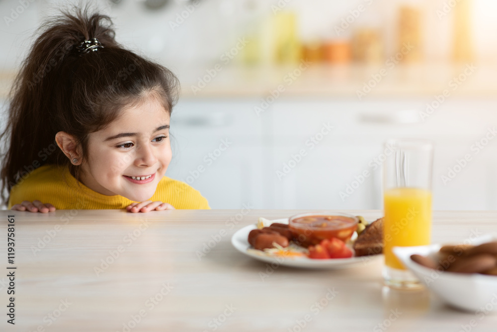Cute funny little arab girl peeking from under the table, looking at plate with tasty food, hungry impatient female child glancing at delicious meal and smiling, ready to eat breakfast or lunch Cute funny little arab girl peeking from under the table, looking at plate with tasty food, hungry impatient female child glancing at delicious meal and smiling, ready to eat breakfast or lunch