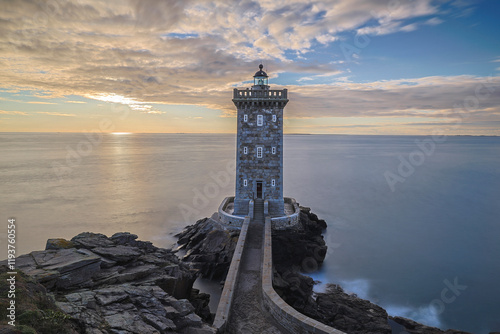 France, Brittany, Le Conquet. Sun setting at the Kermorvan Lighthouse photo