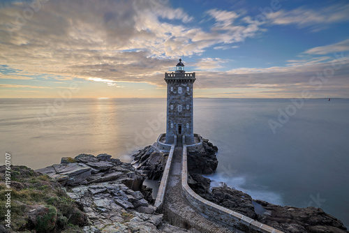 France, Brittany, Le Conquet. Sun setting at the Kermorvan Lighthouse photo