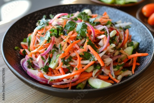 Crisp and vibrant salad made of fresh vegetables including carrots, onions, and cucumbers displayed on a wooden surface. Perfect for a healthy meal or side dish
