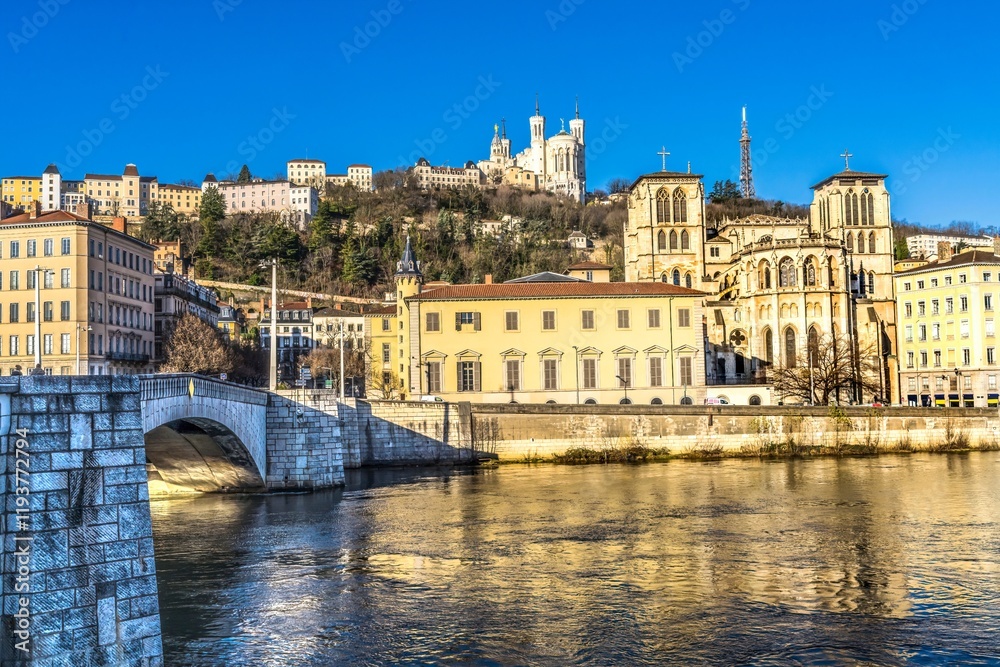 Soane River reflection Bonaparte Bridge, St. John Baptist Cathedral, Notre Dame Basilica outside from City Center, Lyon, France. Soane River reflection Bonaparte Bridge, St. John Baptist Cathedral, Notre Dame Basilica outside from City Center, Lyon, France.