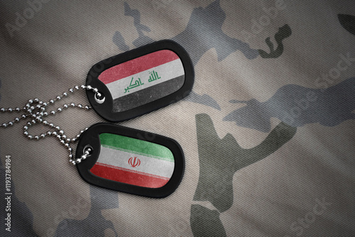 vintage army blank, dog tag with flag of iraq and iran on the khaki texture background. military concept. photo