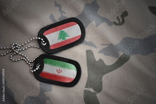 vintage army blank, dog tag with flag of lebanon and iran on the khaki texture background. military concept. photo