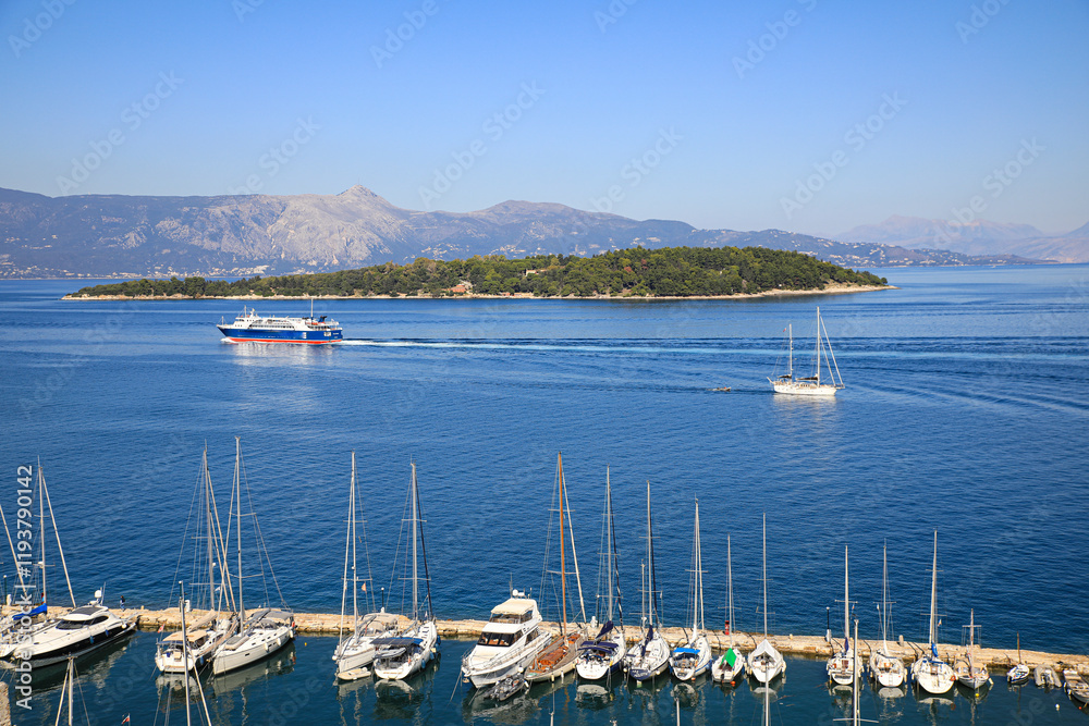 Corfu, Greece. Sailing the sightseeing boat and a sailboat marina